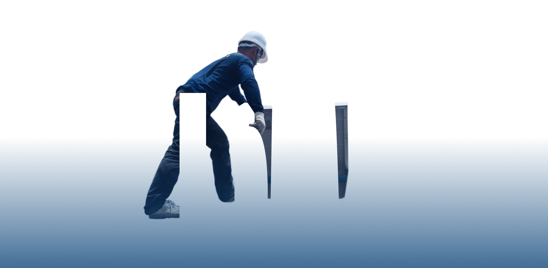 A solar technician in safety gear installs a photovoltaic panel on a rooftop under a clear sky