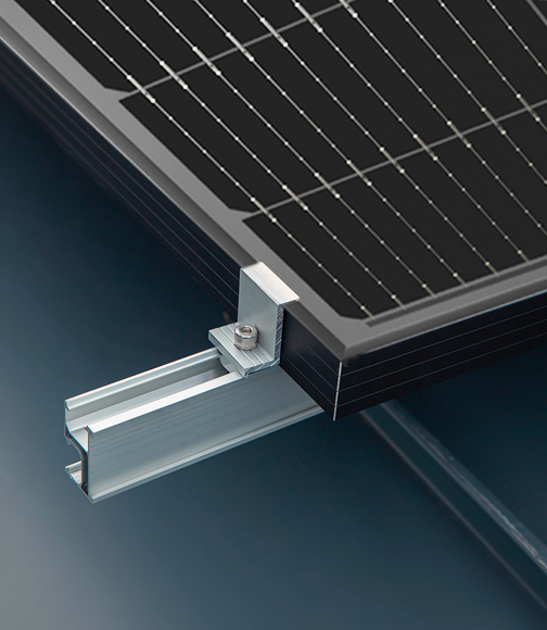 Close-up of a black-frame solavita solar panel mounted on an aluminum rail using a metal clamp bracket